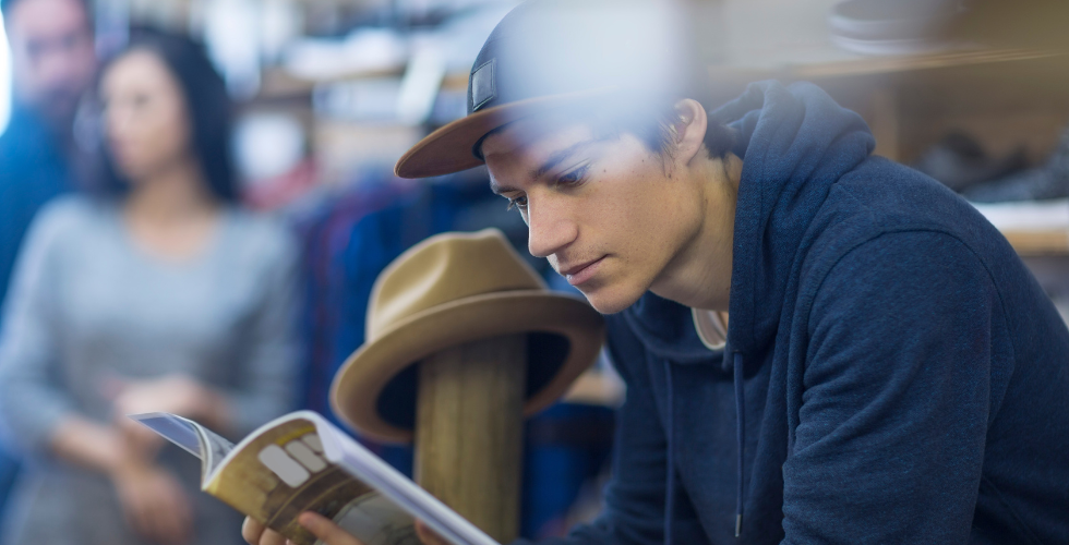 young-man-reading-magazine